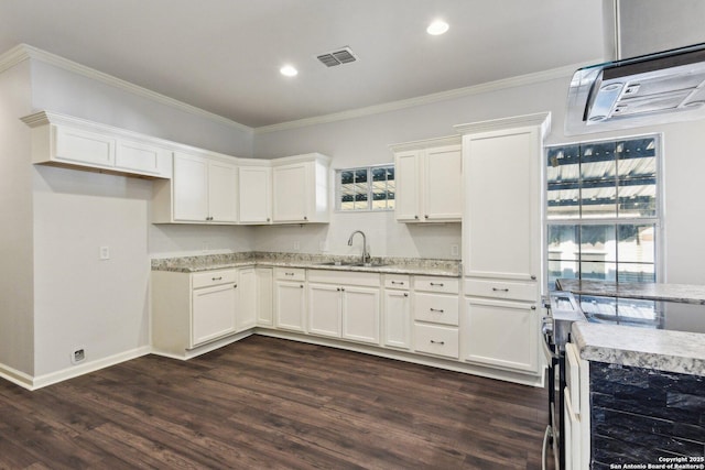 140 E Dullnig, San Antonio, TX 78223 - kitchen featuring a sink, stainless steel range with electric stovetop, crown molding, dark wood-style floors, and white cabinetry