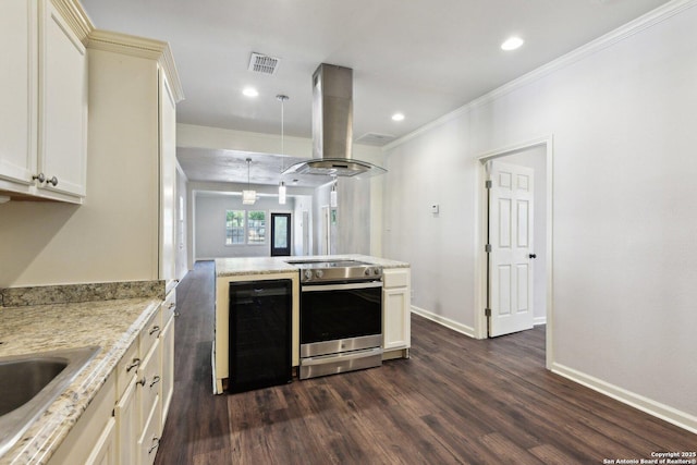 140 E Dullnig, San Antonio, TX 78223 - kitchen with electric range, dark wood-type flooring, island exhaust hood, ornamental molding, and baseboards