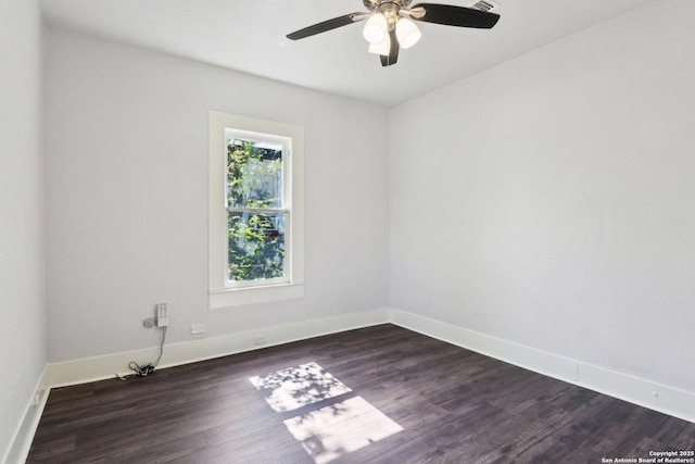 140 E Dullnig, San Antonio, TX 78223 - unfurnished room featuring a ceiling fan, dark wood-style flooring, and baseboards