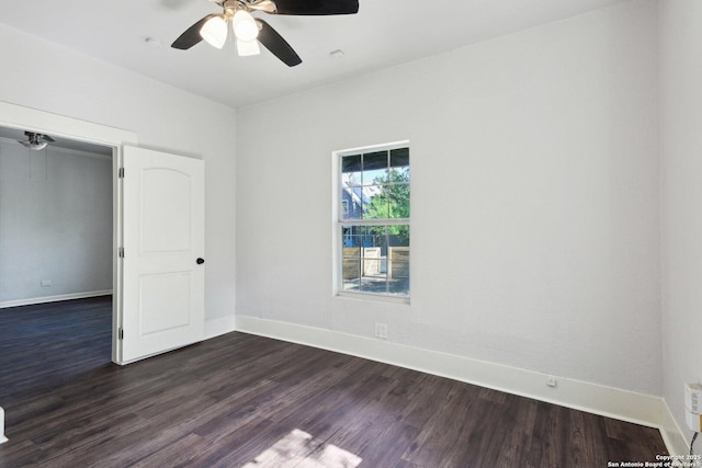 140 E Dullnig, San Antonio, TX 78223 - unfurnished room featuring dark wood-type flooring, a ceiling fan, and baseboards