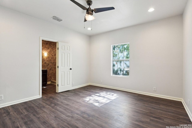140 E Dullnig, San Antonio, TX 78223 - spare room with a ceiling fan, dark wood-style flooring, baseboards, and recessed lighting