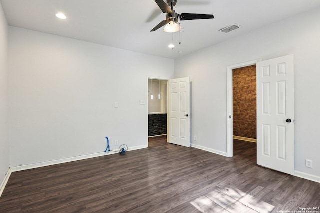 140 E Dullnig, San Antonio, TX 78223 - unfurnished bedroom featuring dark wood finished floors, baseboards, a spacious closet, recessed lighting, and a ceiling fan