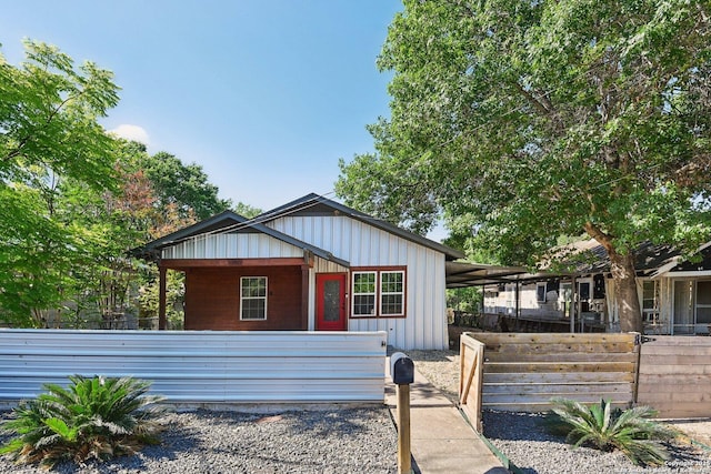 140 E Dullnig, San Antonio, TX 78223 - view of front of house featuring board and batten siding and fence