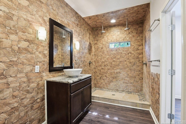 140 E Dullnig, San Antonio, TX 78223 - full bath featuring wood finished floors, vanity, and a tile shower