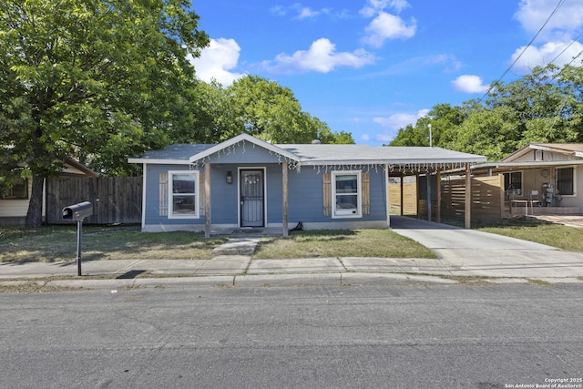 829 Stonewall St, San Antonio, TX 78211 - view of front of property with driveway, fence, and an attached carport