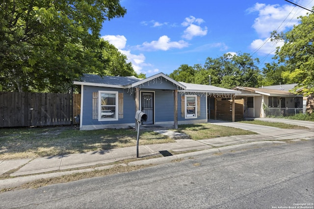 829 Stonewall St, San Antonio, TX 78211 - view of front facade with fence and concrete driveway