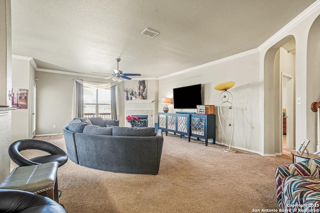 222 Red Quill Nest, San Antonio, TX 78253 - living room with light colored carpet, crown molding, arched walkways, baseboards, and ceiling fan