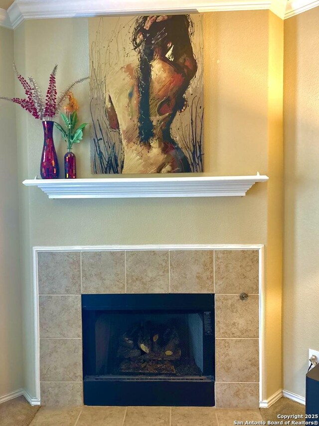 222 Red Quill Nest, San Antonio, TX 78253 - detailed view of a tile fireplace, crown molding, and baseboards