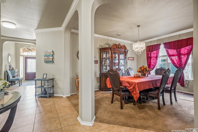 222 Red Quill Nest, San Antonio, TX 78253 - dining room with arched walkways, a chandelier, plenty of natural light, crown molding, and a textured ceiling