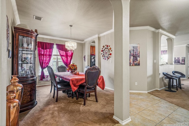 222 Red Quill Nest, San Antonio, TX 78253 - dining room featuring carpet flooring, arched walkways, ornamental molding, a chandelier, and baseboards