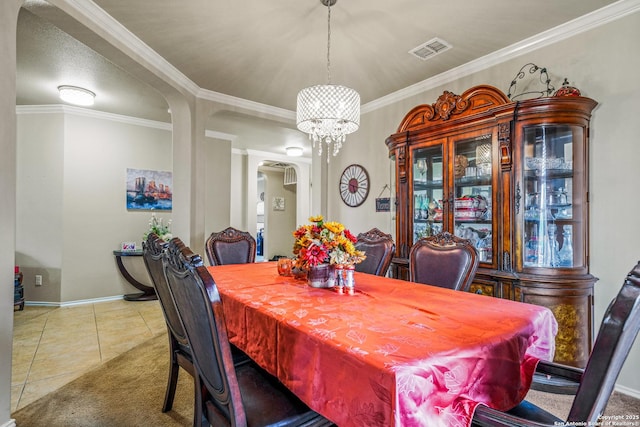 222 Red Quill Nest, San Antonio, TX 78253 - dining space featuring arched walkways, baseboards, tile patterned floors, a chandelier, and ornamental molding