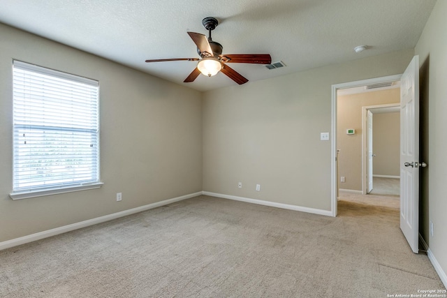 6046 Luckey Run, San Antonio, TX 78252 - unfurnished room with carpet flooring, a ceiling fan, baseboards, and a textured ceiling