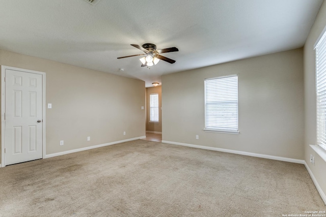 6046 Luckey Run, San Antonio, TX 78252 - spare room featuring a ceiling fan, carpet flooring, and baseboards