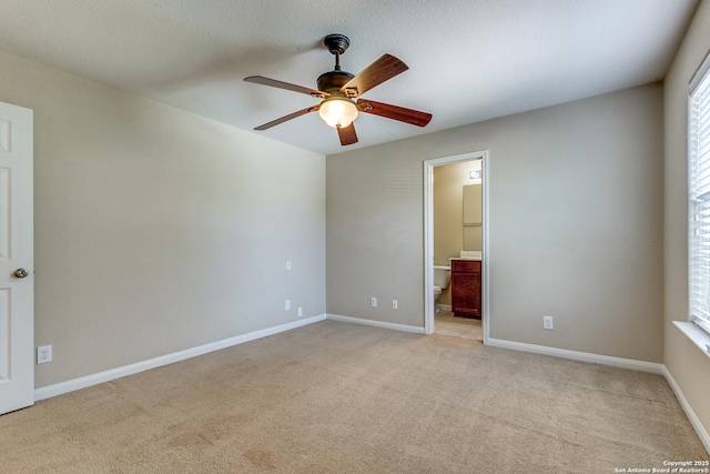 6046 Luckey Run, San Antonio, TX 78252 - spare room featuring ceiling fan, light colored carpet, and baseboards