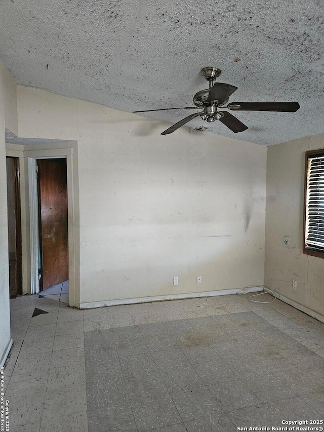 259 Spaatz, San Antonio, TX 78211 - spare room featuring tile patterned floors, a ceiling fan, and baseboards
