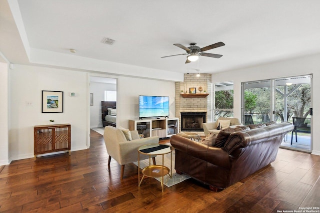 living room with ceiling fan, hardwood / wood-style floors, a fireplace, and baseboards