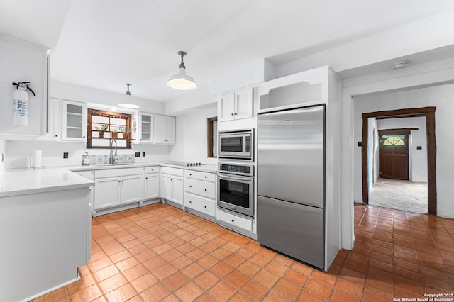 1213 Isabella, Castroville, TX 78009 - kitchen with built in appliances, open shelves, a sink, white cabinetry, and glass insert cabinets