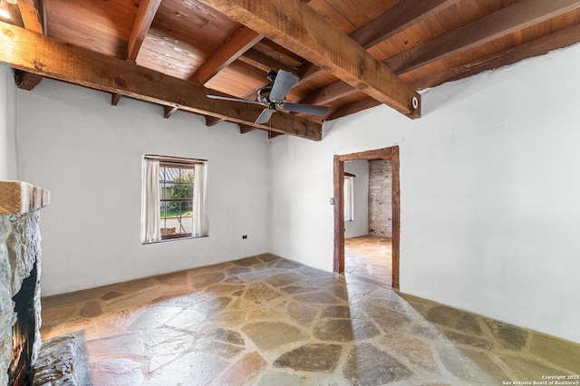 1213 Isabella, Castroville, TX 78009 - empty room with wood ceiling, stone flooring, beamed ceiling, and ceiling fan
