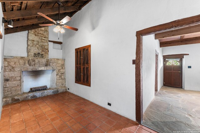 1213 Isabella, Castroville, TX 78009 - unfurnished living room featuring a stone fireplace, ceiling fan, and wood ceiling