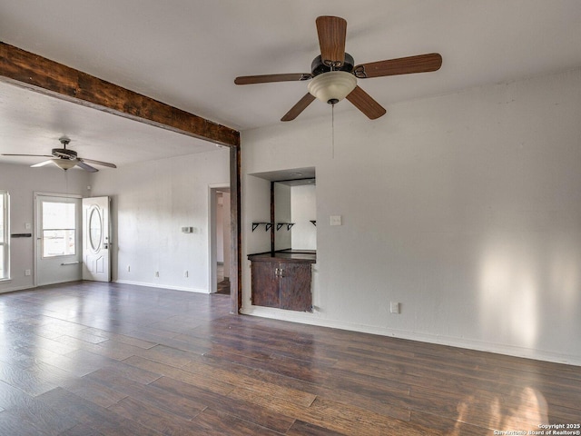 4330 Kilrea, San Antonio, TX 78219 - unfurnished living room featuring ceiling fan, wood finished floors, beam ceiling, and baseboards
