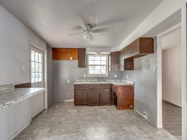4330 Kilrea, San Antonio, TX 78219 - kitchen with ceiling fan, plenty of natural light, a sink, and light countertops