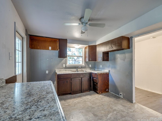 4330 Kilrea, San Antonio, TX 78219 - kitchen featuring a sink, a ceiling fan, and light countertops
