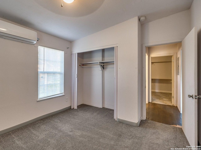 4330 Kilrea, San Antonio, TX 78219 - unfurnished bedroom with a wall unit AC, carpet flooring, a closet, and baseboards