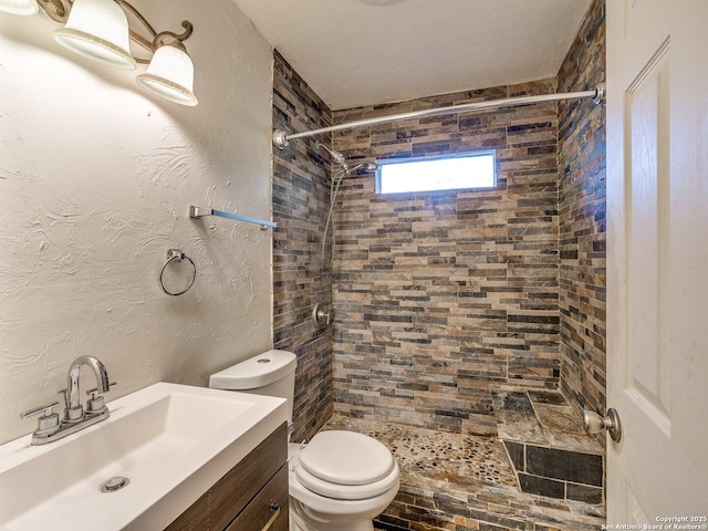 4330 Kilrea, San Antonio, TX 78219 - full bathroom featuring toilet, a tile shower, and vanity