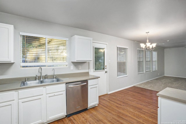 135 Blue Juniper, San Antonio, TX 78253 - kitchen with dishwasher, a sink, a chandelier, white cabinets, and pendant lighting