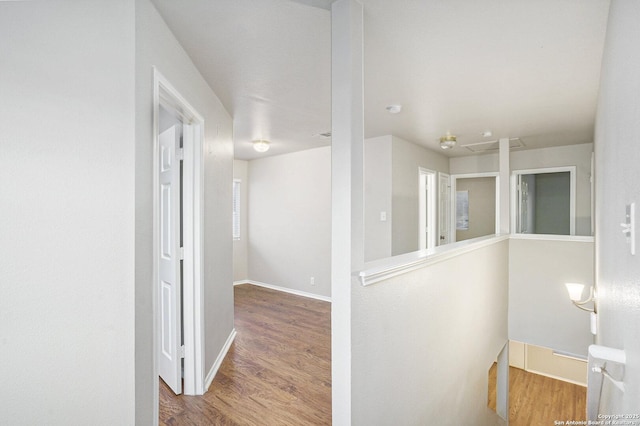 135 Blue Juniper, San Antonio, TX 78253 - corridor with an upstairs landing, wood finished floors, and baseboards