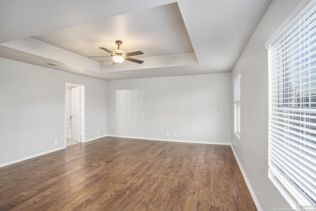135 Blue Juniper, San Antonio, TX 78253 - spare room with a tray ceiling, ceiling fan, dark wood-style flooring, baseboards, and crown molding