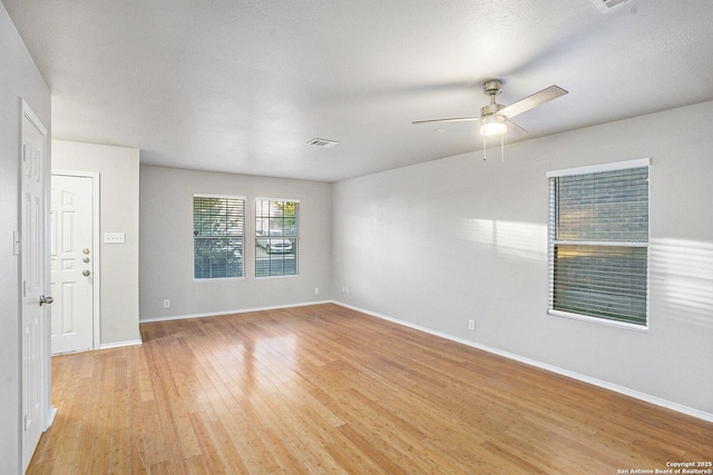 135 Blue Juniper, San Antonio, TX 78253 - spare room with light wood finished floors, a ceiling fan, and baseboards