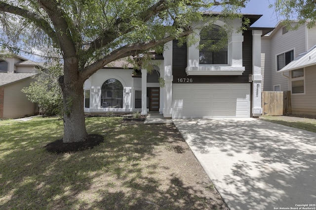 16726 Burning Glade, San Antonio, TX 78247 - view of front facade featuring concrete driveway, a garage, and stucco siding