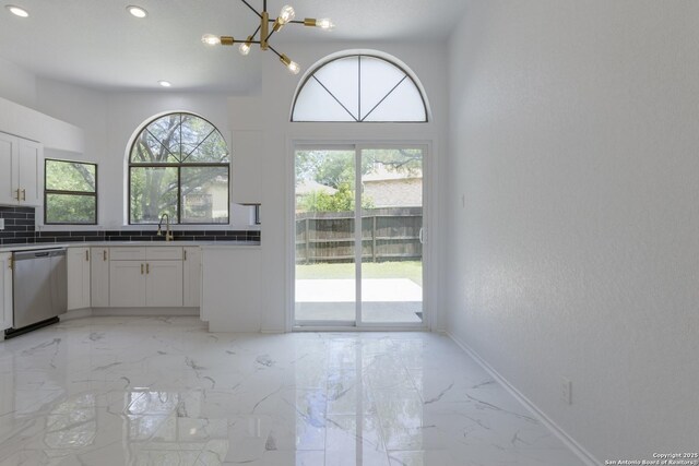 16726 Burning Glade, San Antonio, TX 78247 - kitchen featuring dishwasher, plenty of natural light, a chandelier, light marble finish floors, and recessed lighting