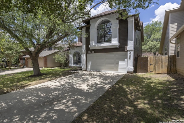 16726 Burning Glade, San Antonio, TX 78247 - view of front facade with concrete driveway, fence, and a garage