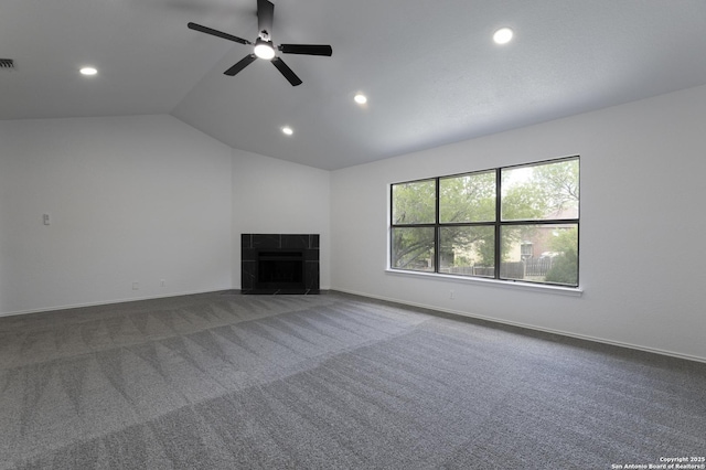 16726 Burning Glade, San Antonio, TX 78247 - unfurnished living room with recessed lighting, a ceiling fan, carpet, lofted ceiling, and a tile fireplace