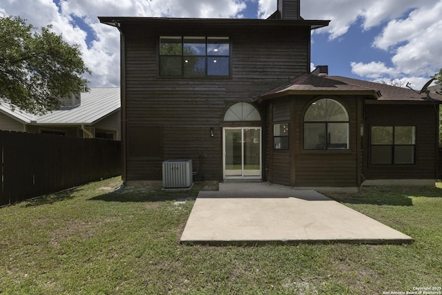 16726 Burning Glade, San Antonio, TX 78247 - rear view of house featuring central air condition unit, a chimney, and a patio