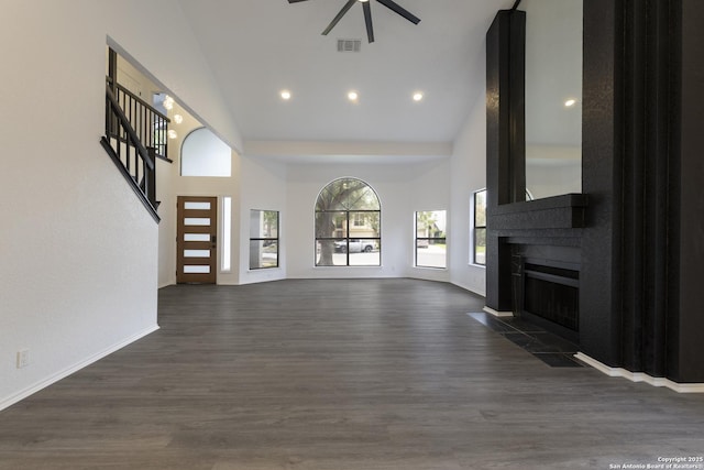16726 Burning Glade, San Antonio, TX 78247 - unfurnished living room featuring high vaulted ceiling, ceiling fan, a fireplace, dark wood finished floors, and recessed lighting