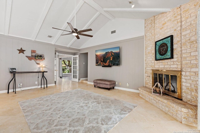 13018 Country Trl, San Antonio, TX 78216 - living room featuring tile patterned flooring, a ceiling fan, beamed ceiling, a fireplace, and high vaulted ceiling