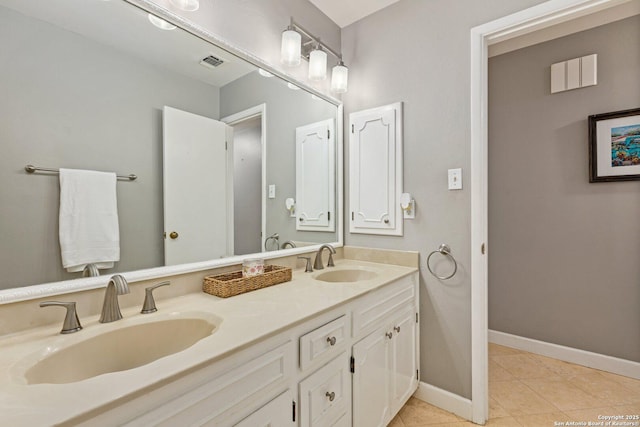 13018 Country Trl, San Antonio, TX 78216 - bathroom featuring tile patterned flooring, baseboards, and double vanity