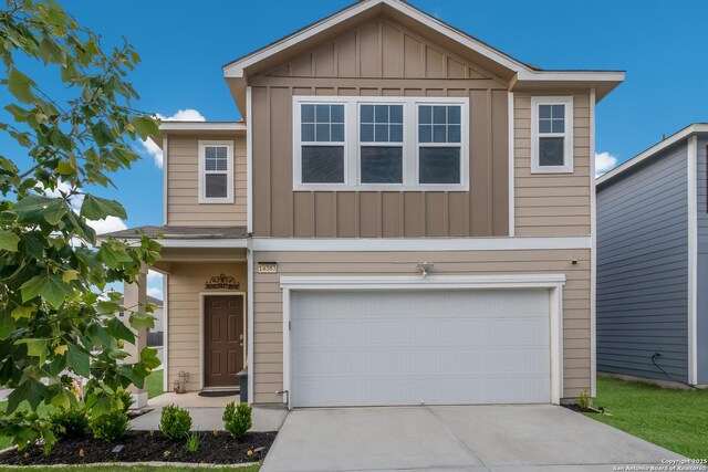 14383 Palm Rdg, San Antonio, TX 78253 - view of front of property with an attached garage, board and batten siding, and concrete driveway