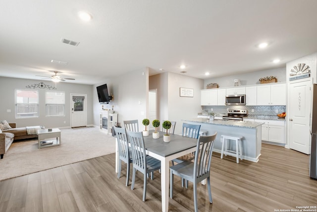 14383 Palm Rdg, San Antonio, TX 78253 - dining space with light wood-style floors, a ceiling fan, recessed lighting, and baseboards