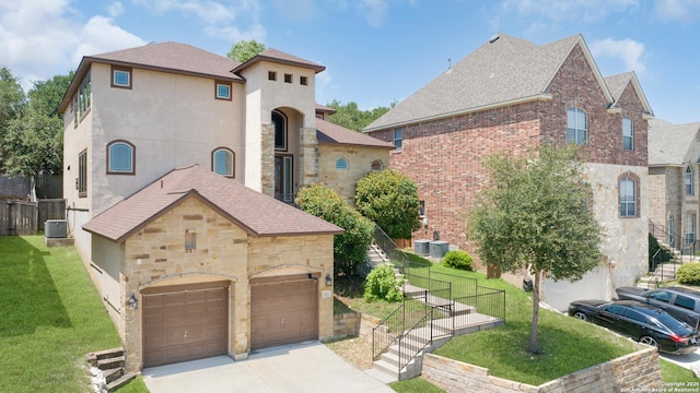 523 White Cyn, San Antonio, TX 78260 - view of front of house featuring a front yard, a garage, a shingled roof, stone siding, and driveway