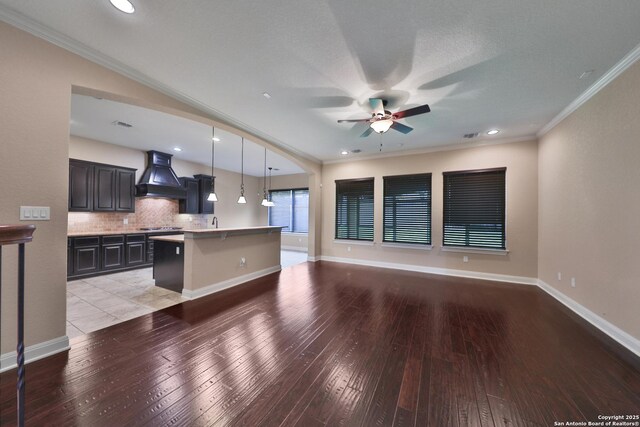 523 White Cyn, San Antonio, TX 78260 - kitchen featuring premium range hood, open floor plan, ornamental molding, light wood finished floors, and a ceiling fan