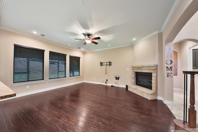 523 White Cyn, San Antonio, TX 78260 - unfurnished living room featuring a ceiling fan, wood finished floors, a fireplace, arched walkways, and recessed lighting