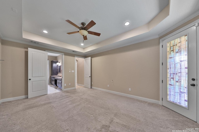 523 White Cyn, San Antonio, TX 78260 - unfurnished bedroom with a tray ceiling, light colored carpet, recessed lighting, and baseboards