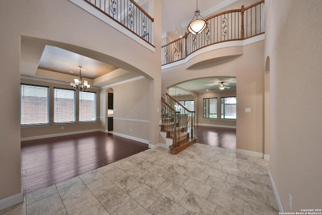 523 White Cyn, San Antonio, TX 78260 - foyer entrance with arched walkways, baseboards, and stairway