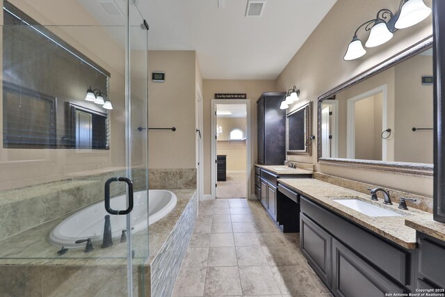 523 White Cyn, San Antonio, TX 78260 - bathroom featuring double vanity, a garden tub, tile patterned flooring, and a stall shower