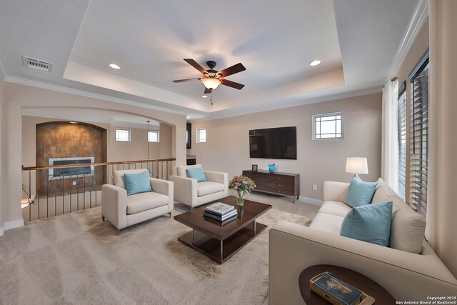 523 White Cyn, San Antonio, TX 78260 - carpeted living area featuring a tray ceiling, ceiling fan, recessed lighting, baseboards, and crown molding