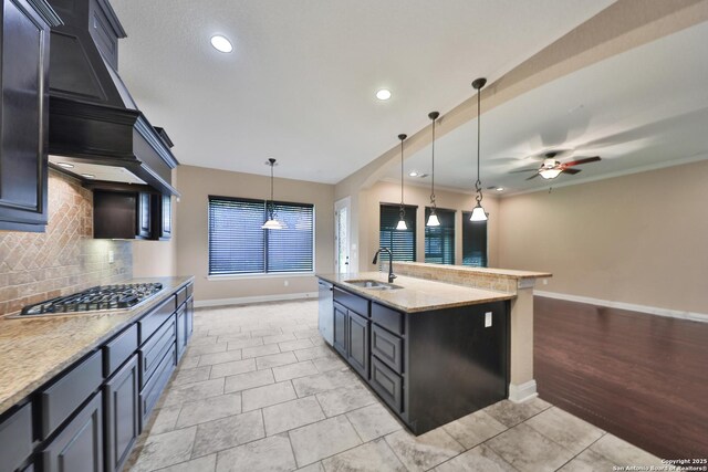 523 White Cyn, San Antonio, TX 78260 - kitchen with a sink, appliances with stainless steel finishes, decorative backsplash, baseboards, and a ceiling fan